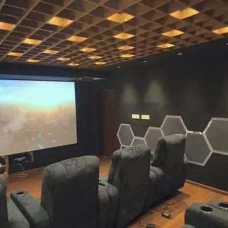 This is the ultimate goal: a dedicated home theater I designed and installed for a client in Sahakarnagar. Notice the plush recliners, the projector screen for a true cinema feel, and the acoustic treatments on the ceiling and walls for perfect sound.