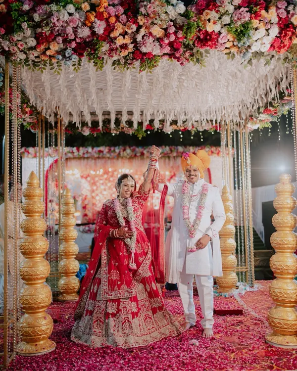 A moment of pure celebration after the wedding rituals. I focus on capturing the grand scale of your celebration, including the beautiful mandap decor and the joyous atmosphere as you begin your new life together.