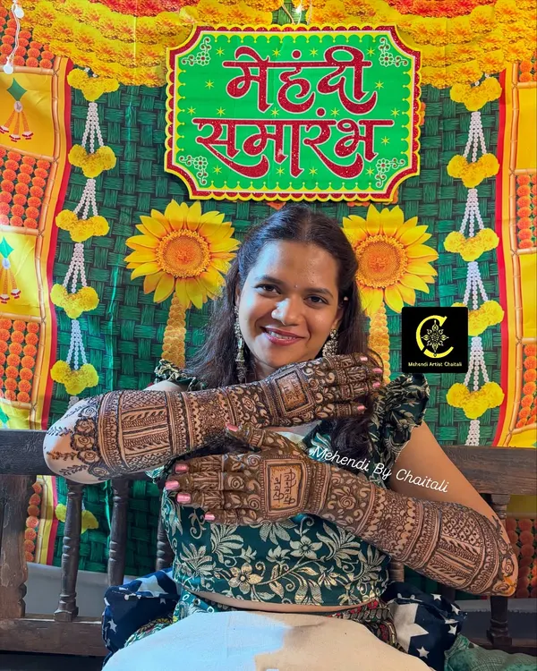 A happy bride posing at her "Mehendi Samarambh" (Mehendi Ceremony). Her smile and her beautiful, dark mehendi are what make my work so fulfilling.