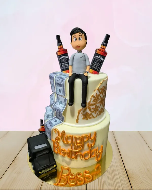 A "Boss" birthday cake for someone who enjoys the finer things. This two-tiered cake features edible money, miniature Jack Daniel's bottles, and a sculpted figurine.