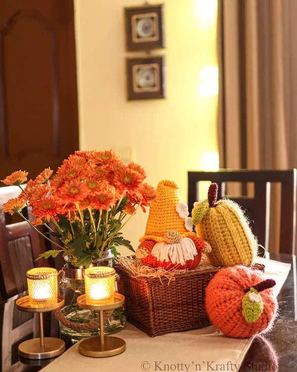The 'ber' months bring the best colors. Here is a festive autumn tablescape featuring my Pumpkin Gnome, a crochet corn cob, and a plump orange pumpkin.