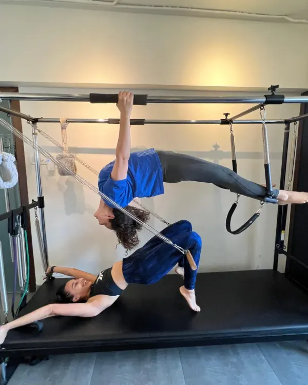 This is the essence of Pilates: a blend of strength, control, and grace. Here, I am guiding Kangana Ranaut through an advanced movement on the Cadillac, showcasing the kind of full body integration and core stability we work towards in every session. It’s about moving with intention and precision.