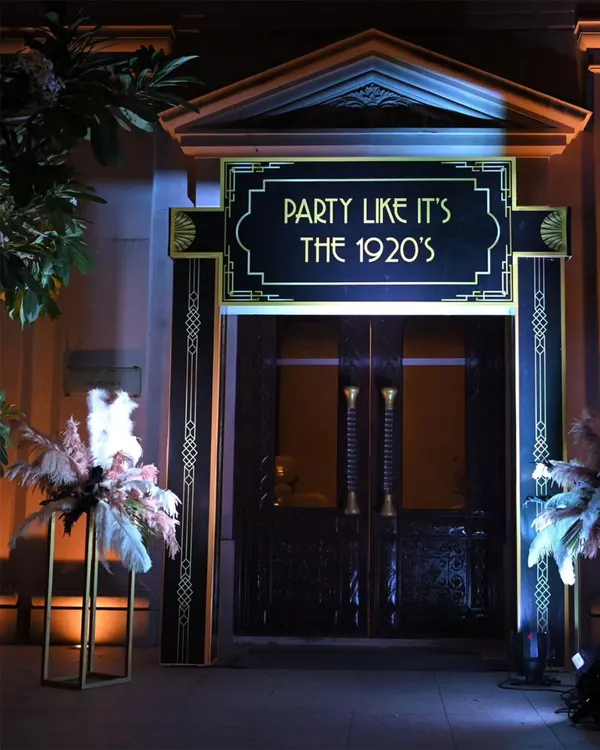 For this Great Gatsby themed party, we transformed the entrance to transport guests back to the roaring 1920s. The art deco design and bold signage set the stage for a night of glamour and extravagance.