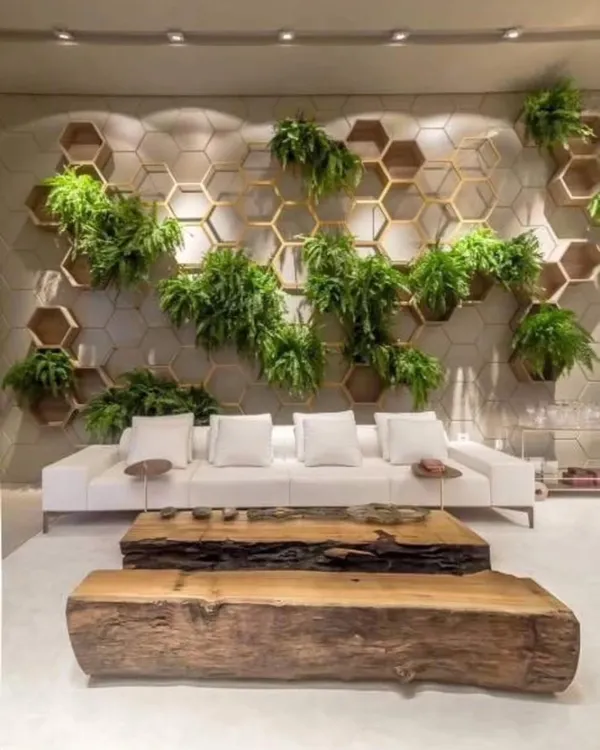 I can transform your living room with a custom feature wall. This design uses a honeycomb wood frame with artificial ferns to create a modern, high-end look that requires no maintenance.
