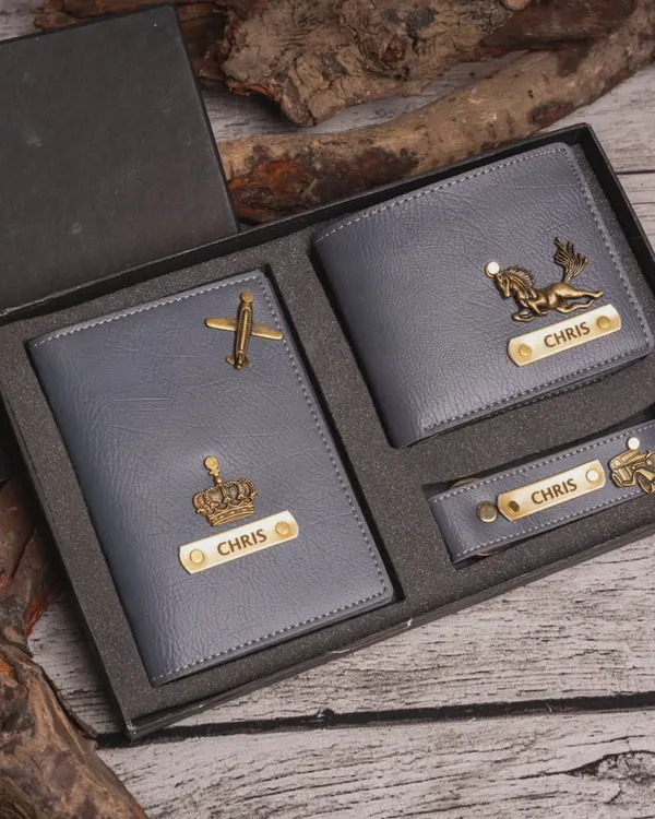 This men's essentials gift set in grey includes a personalized wallet, passport cover, and keychain, presented in a premium gift box.