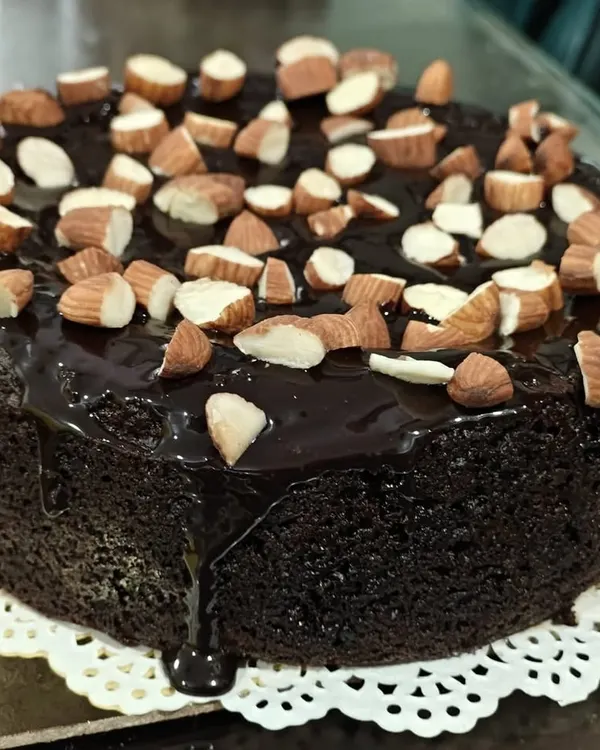 This beautiful almond-topped chocolate cake is a perfect example of healthy indulgence. The rich chocolate flavour comes through without any sugar, maida, or butter, making it an ideal guilt-free treat for your next celebration.