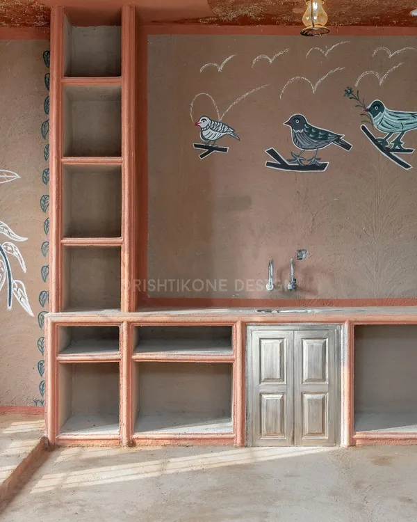 Welcome to "Chulha Rasoi," our unique village-style rooftop kitchen. This space celebrates heritage with authentic clay walls, open shelving, and beautiful chalk murals hand-drawn by local artists.