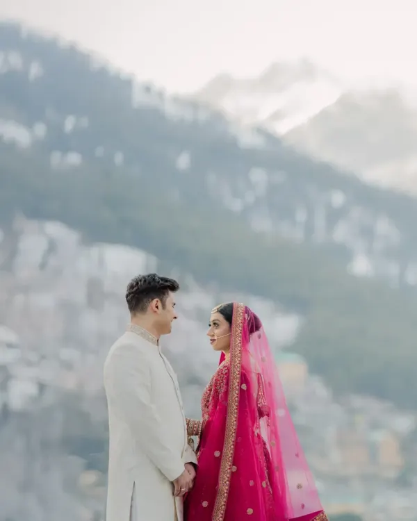 Against the vastness of the Manali mountains, the couple shares a look. This is more than a portrait; it's a story of love as grand as the landscape.