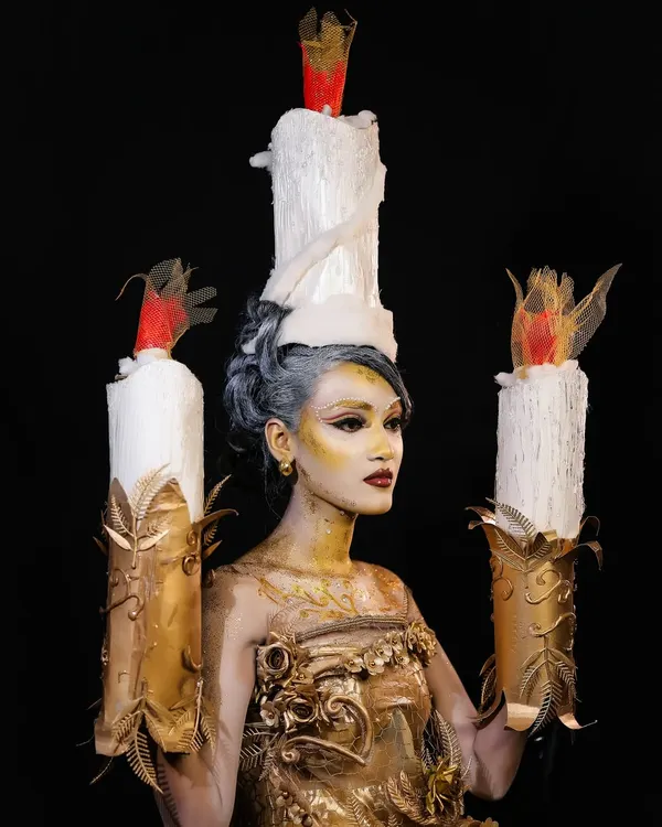 A full-frontal view of the "Lumiere" inspired creation. This look required skills in body painting, custom prop making, and creating a cohesive character from head to toe.
