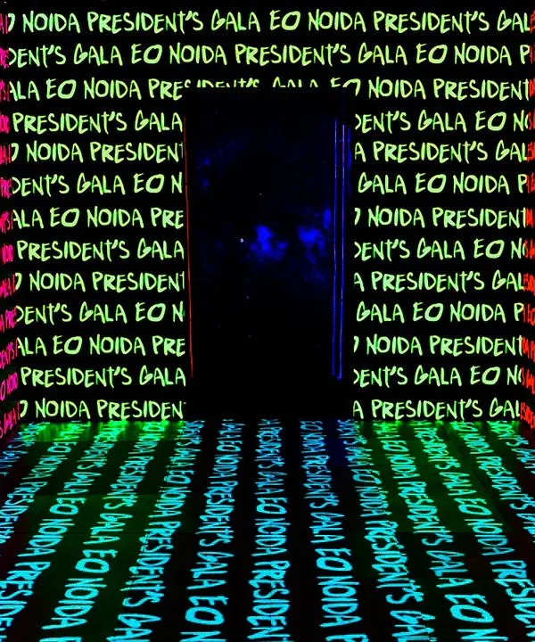 An immersive LED tunnel we designed for the EO Noida President's Gala. We created this entrance to build anticipation, with walls and floors covered in animated text that set the stage for the 'Matrix Night' theme.