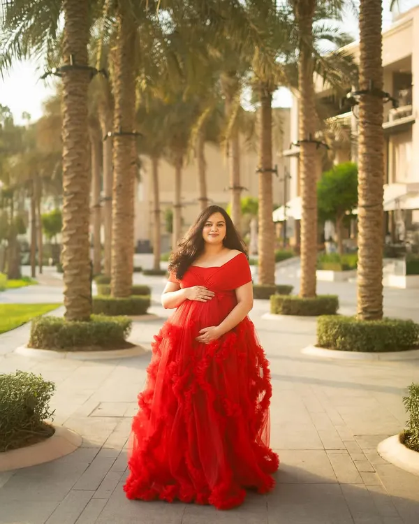 This is the moment that captures it all. The vibrant red gown against the beautiful Dubai palms during the golden hour is pure magic. I love creating these breathtaking portraits that feel like they are straight out of a fairytale.