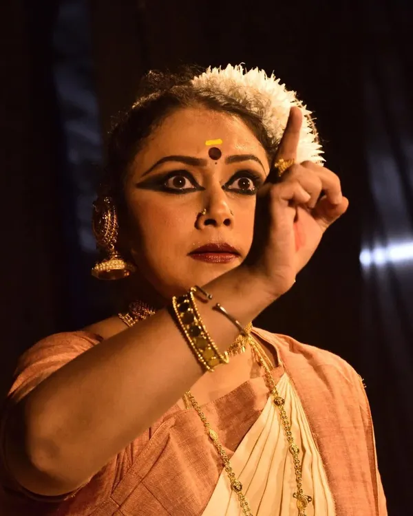 The power of expression in a solo Mohiniyattam performance. This intense moment was captured during a sacred temple offering.