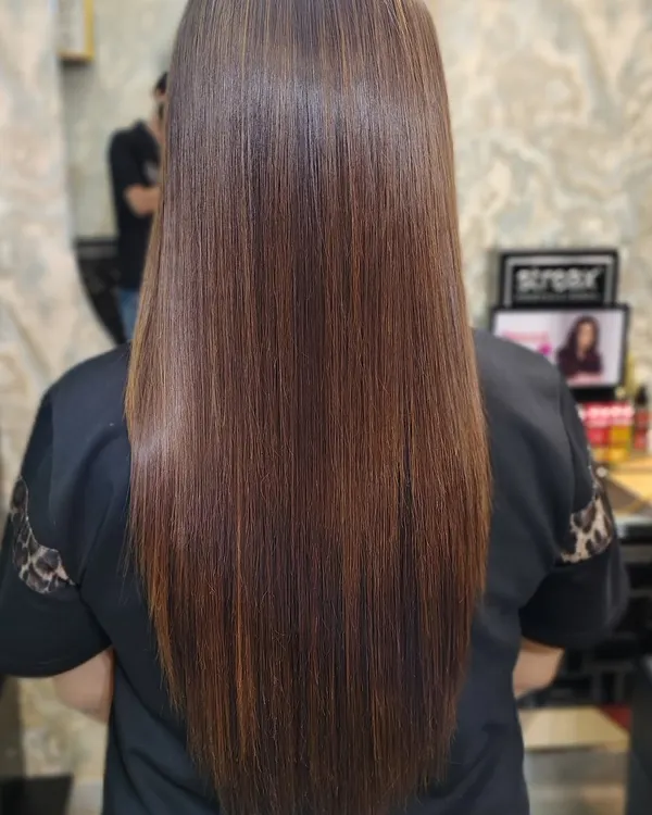 Haina gorgeous? This client's hair is sleek and straight, which really shows off the fine mocha caramel highlights I added for a subtle, sophisticated look.