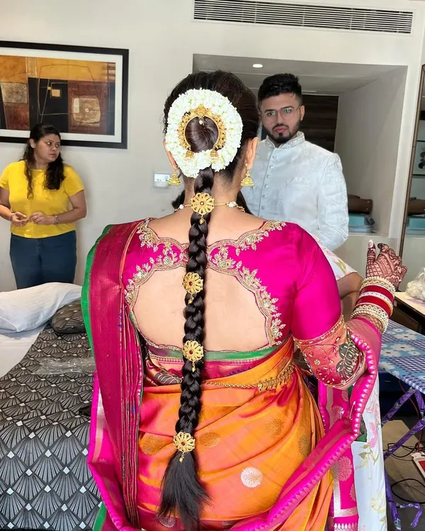 This is my signature South Indian bridal hairstyle. I meticulously craft the traditional braid, adorning it with a beautiful gajra and temple-style jewellery to create a look that is both authentic and breathtaking.