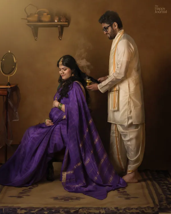 A quiet moment of connection during a traditional maternity shoot. Here, the husband performs the 'sambrani' ritual, a beautiful act of care that I capture to make your photos deeply personal and culturally rich.
