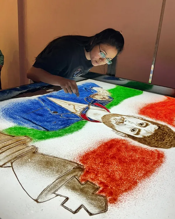 A sand art tribute to chess prodigy Gukesh Dommaraju, celebrating his championship win. I used colored sand to create a dynamic composition with the chess piece and his portrait.
