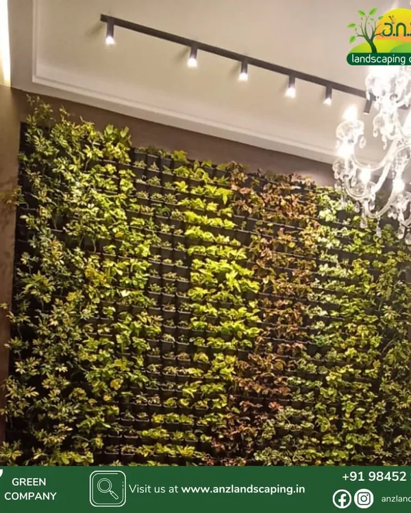 We transformed this interior wall into a lush, vibrant focal point. This floor-to-ceiling living wall, illuminated by modern track lighting, brings a sense of luxury and natural tranquility to the space, improving both aesthetics and air quality.