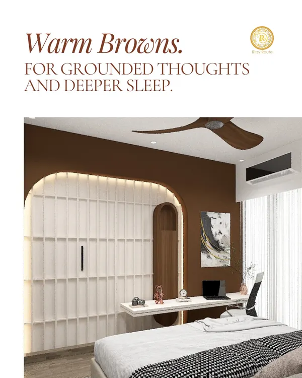The warm brown accent wall in this bedroom is chosen specifically for its grounding properties, which Vastu suggests can lead to more settled thoughts and deeper sleep. Paired with a functional built-in desk and soft lighting, this room is a perfect blend of a productive workspace and a restful sanctuary.