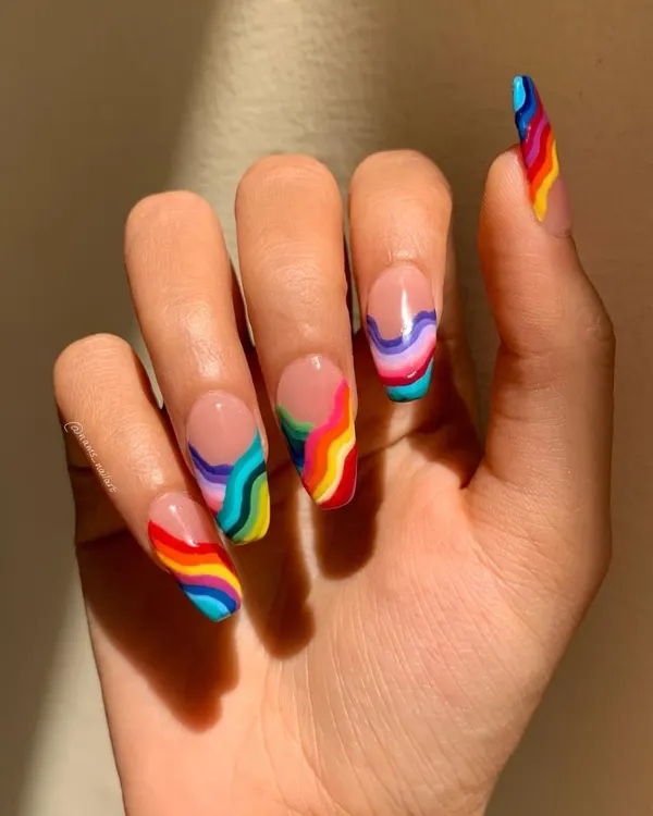 Make a bright and bold statement with this rainbow wave design. This intricate freehand art on a clear base shows my skill in creating clean lines and vibrant color combinations.