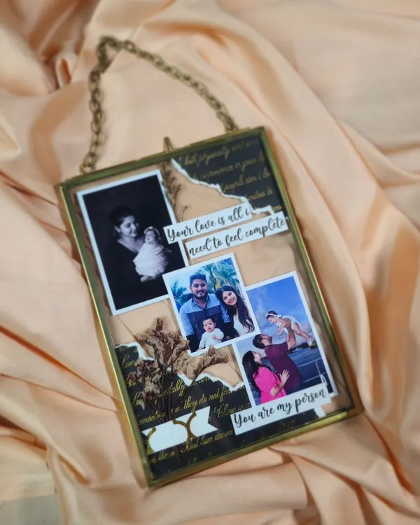 This custom glass floating frame is a beautiful way to display cherished photos. I arrange your pictures with quotes and decorative paper to create a unique, collage-style piece of art.