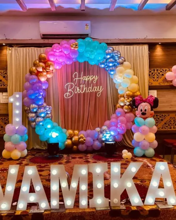 This Minnie Mouse themed first birthday is one of our favorites. The full balloon ring, lit-up marquee name, and character details create a perfect photo backdrop and a magical atmosphere for your little one's big day.