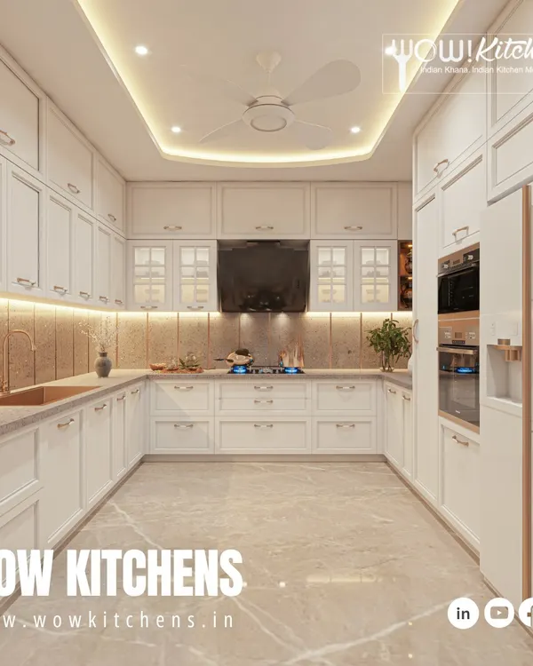 This all-white U-shaped kitchen is a timeless classic. It features profiled cabinet doors, elegant handles, a built-in oven tower, and a beautiful marble-patterned floor for a touch of luxury.