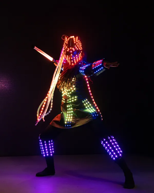 Our pixel warrior strikes a dynamic pose in a fully programmable LED suit. This costume can be customized with logos or specific color schemes for corporate events and brand activations.