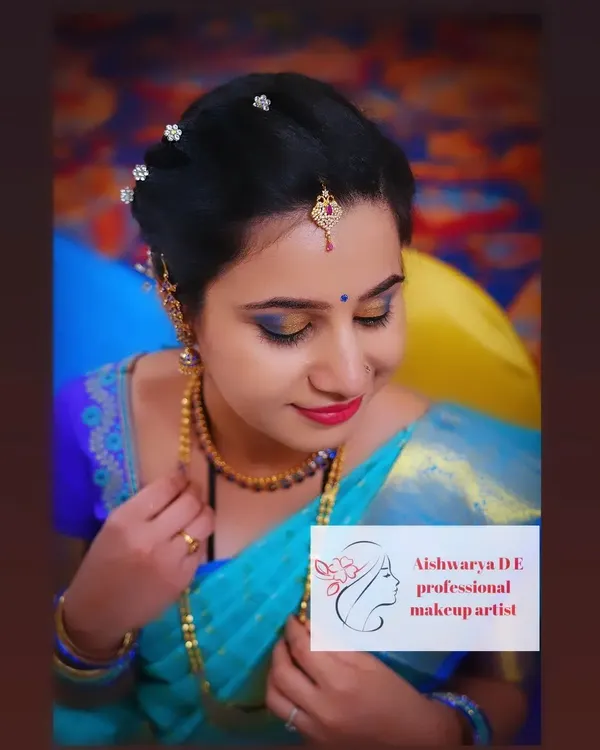 A beautiful, soft glam look perfect for a naming ceremony. I focused on creating a flawless base and highlighting the eyes with a touch of gold and blue to complement her stunning turquoise saree.