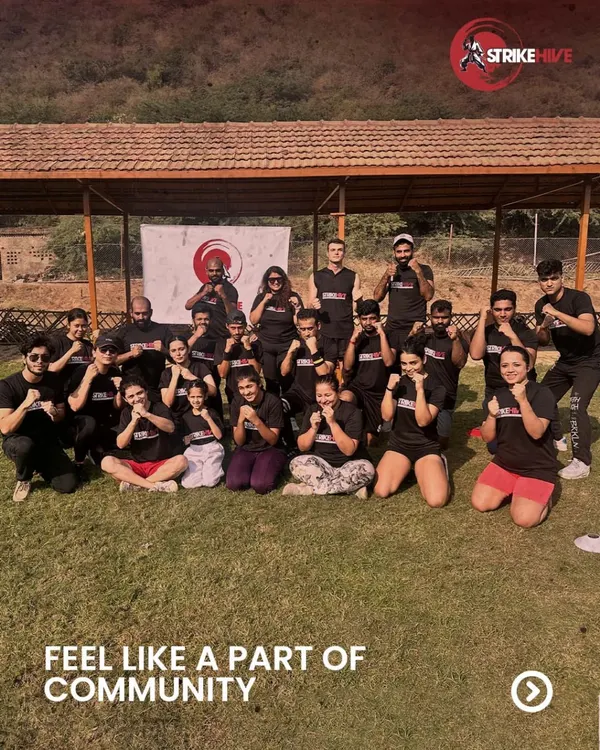 Our members and coaches pose together during an outdoor community event. These gatherings are essential for building the family-like atmosphere that makes StrikeHive a special place to train.