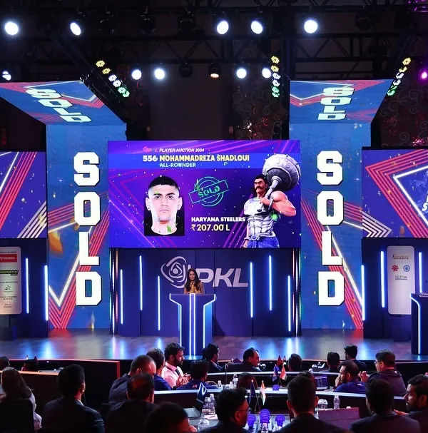 The high-energy stage of the Pro Kabaddi League Player Auction. This demonstrates our specialized service in managing high-stakes auctions, combining dynamic stage design, multi-screen LED displays, and flawless live production for a broadcast-quality event.