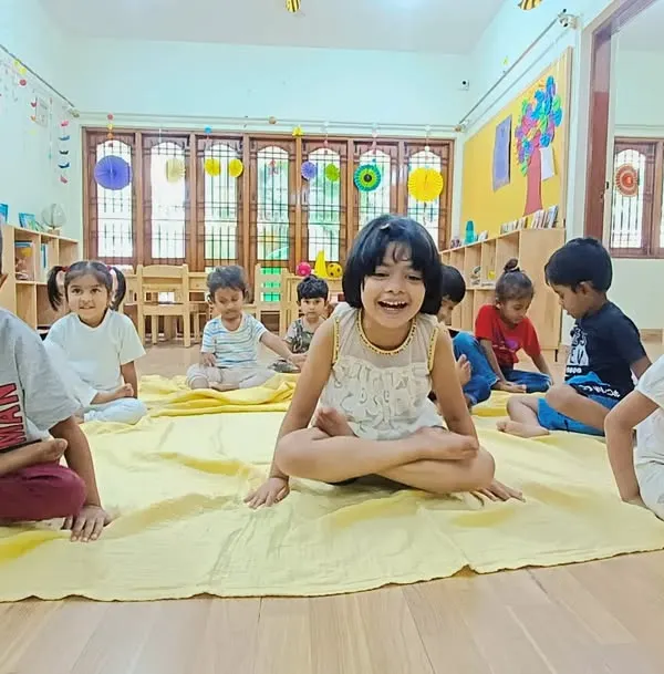The purest form of happiness is a child's laughter. Here, our little Asters find joy and flexibility during one of our fun-filled yoga sessions, an activity that helps build both strong bodies and calm minds.