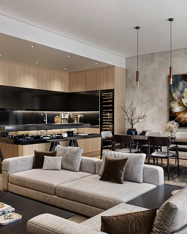 An open-concept luxury living space designed for a client in the USA. This rendering focuses on the interplay of light and texture, from the natural wood paneling and dark stone kitchen island to the soft fabrics of the furniture, creating a warm and inviting atmosphere.