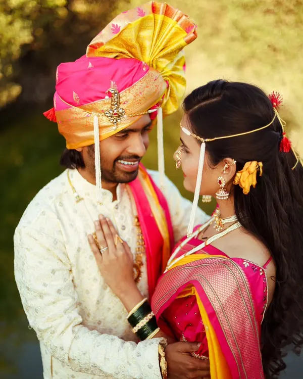 This is what it's all about, capturing that one look between you two. A beautiful, intimate moment from a traditional Maharashtrian couple shoot, focusing on the intricate details of the pheta and the bride's jewelry.