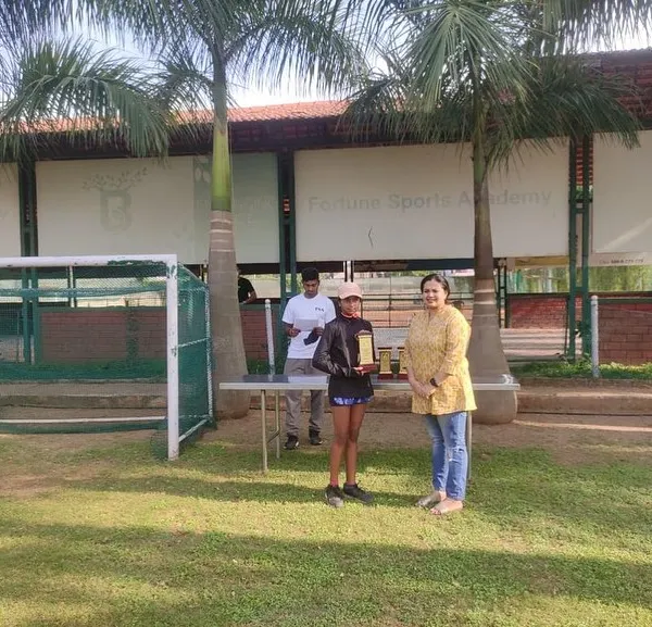 One of our U12 champions receives her award at the FSA KSLTA State Ranking Tennis Tournament in Bangalore. We ensure every event concludes with a formal prize distribution to recognize the hard work of all participants.