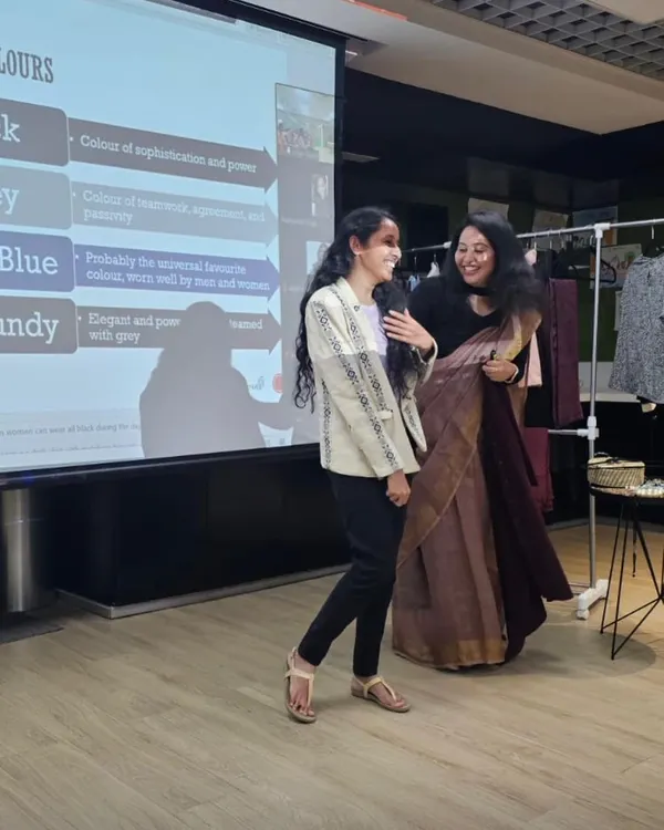 A moment of shared laughter and learning during a power dressing workshop. We were demonstrating how a simple blazer can elevate an outfit and boost confidence.