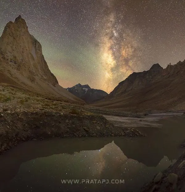 This is the reward for venturing into the remote Zanskar valley. A panoramic view of the Milky Way arching over the majestic Gumbak Ranjan peak, reflected in the still waters below. Capturing this required careful planning and enduring the cold, high-altitude night, but the result is a scene that feels truly out of this world.