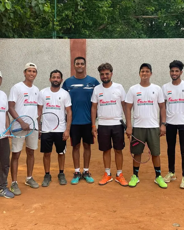 A group photo with the Mastermind Tennis Academy coaching team and players. We foster a strong sense of community and teamwork.