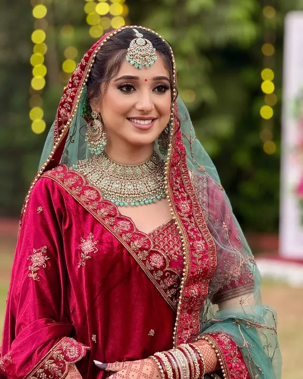 This is the bridal glow I live to create. A timeless look for my stunning bride, featuring soft, radiant skin, beautifully defined eyes, and a classic red velvet lehenga that exudes pure elegance and joy.