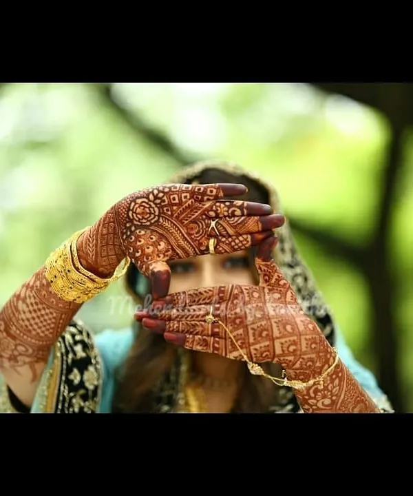 This professional photo captures the stunningly dark and even stain of my natural henna. The bride's intricate mehendi is the star of the show, showcasing the beautiful end result of my work.