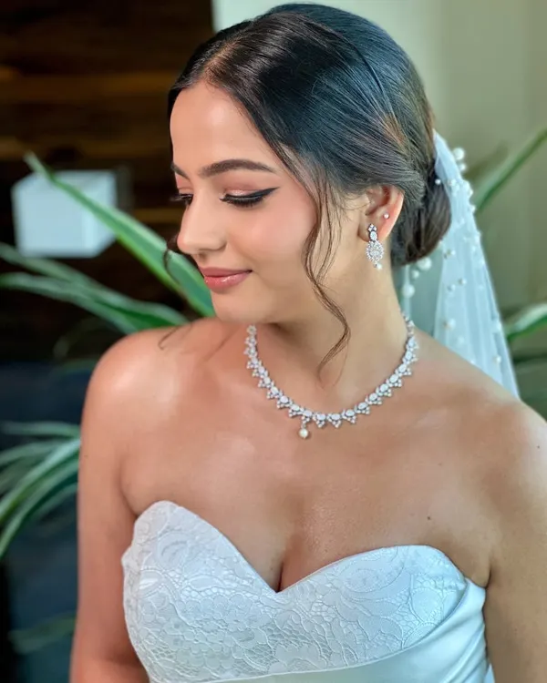 A portrait of my graceful Christian bride, Beracah. Her look was all about soft glam, with a sharp winged liner and glowing skin that radiated pure elegance in her white wedding gown.
