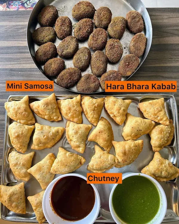 A classic party starter combination of crispy Mini Samosas and flavorful Hara Bhara Kebabs, served with sweet and spicy chutneys.