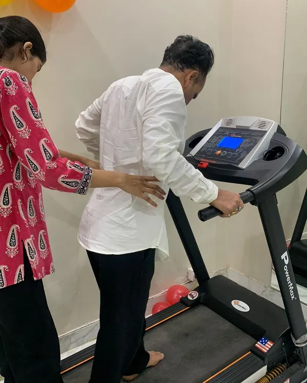 I believe in providing hands-on support throughout your recovery. Here, I am assisting a patient with guided walking on a treadmill, a crucial step in rebuilding strength and coordination after a neurological event like a stroke.