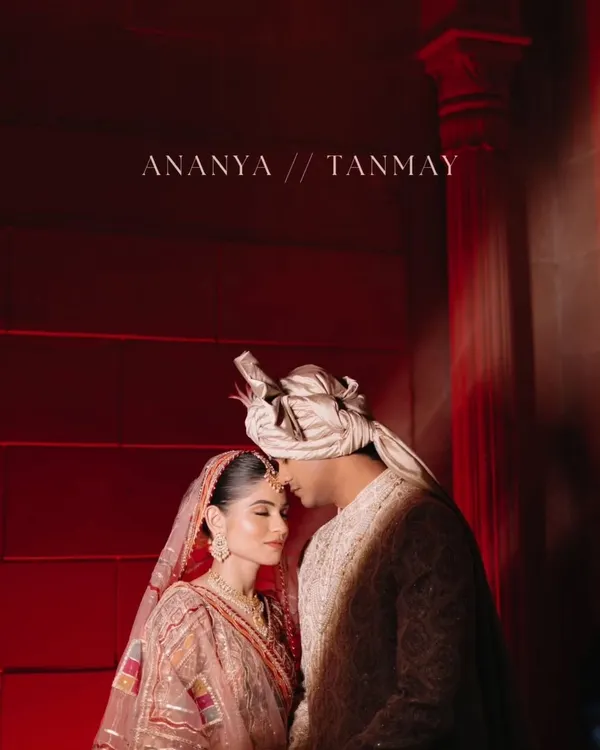 A dramatic and intimate couple portrait, using bold red lighting to create a passionate and cinematic feel for this royal wedding shot.