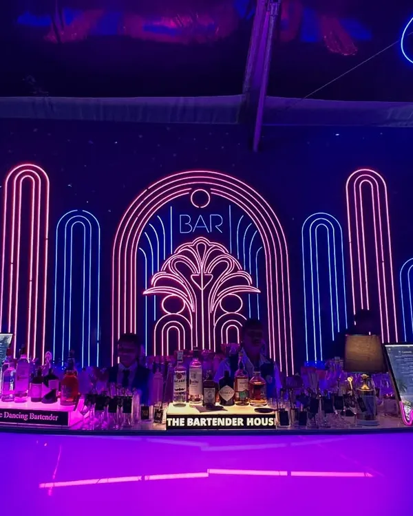 This stunning Art Deco neon bar was the centerpiece of a glamorous sangeet. We design our bars to be more than just functional; they are a core part of your event's decor and aesthetic.