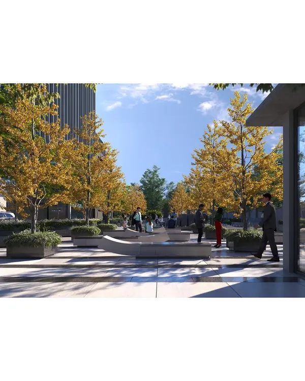 This corporate plaza design features tree-lined avenues and sculptural benches, creating a welcoming and professional atmosphere for employees and visitors during the day.