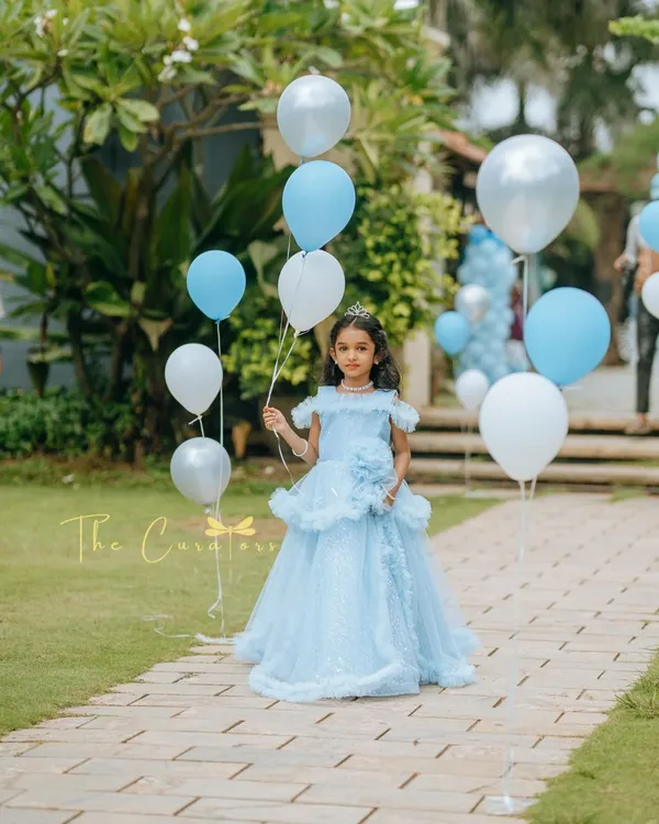 The birthday princess makes her grand entrance. We lined the pathway with balloons in her favorite colors, creating a magical walkway into her very own fairytale party.