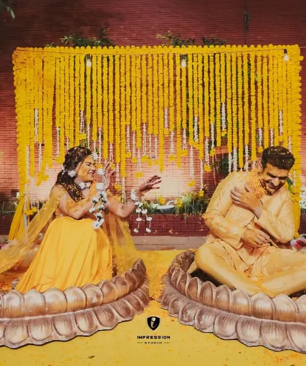 A fun and playful Haldi ceremony. I captured the moment right as the bride playfully puts haldi on the groom, showing the fun-loving nature of their relationship.