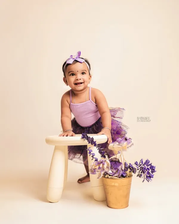 This is the original studio shot. A simple, beautiful portrait of a one-year-old in a purple tutu, which serves as the perfect base for our AI magic.