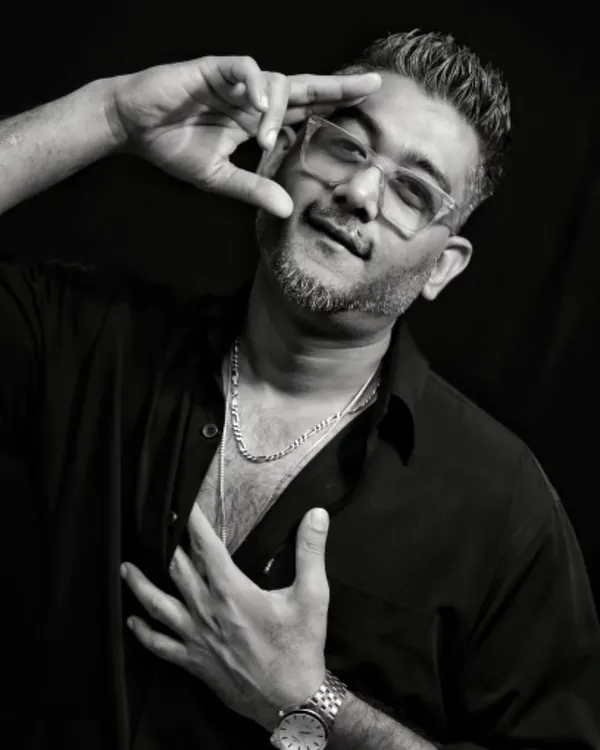 A black and white portrait from a recent photoshoot. This is part of my official press kit, showing a more confident and artistic side of my persona.
