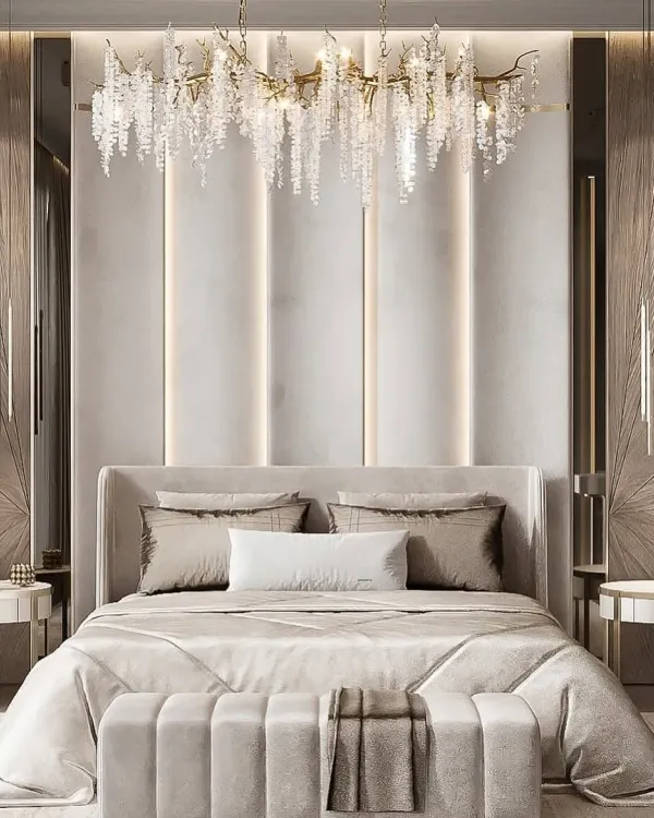 This suite embodies opulence with its dramatic crystal chandelier and textured, wood-paneled walls. We used a monochromatic palette and reflective surfaces to create a space that feels both glamorous and deeply restful.